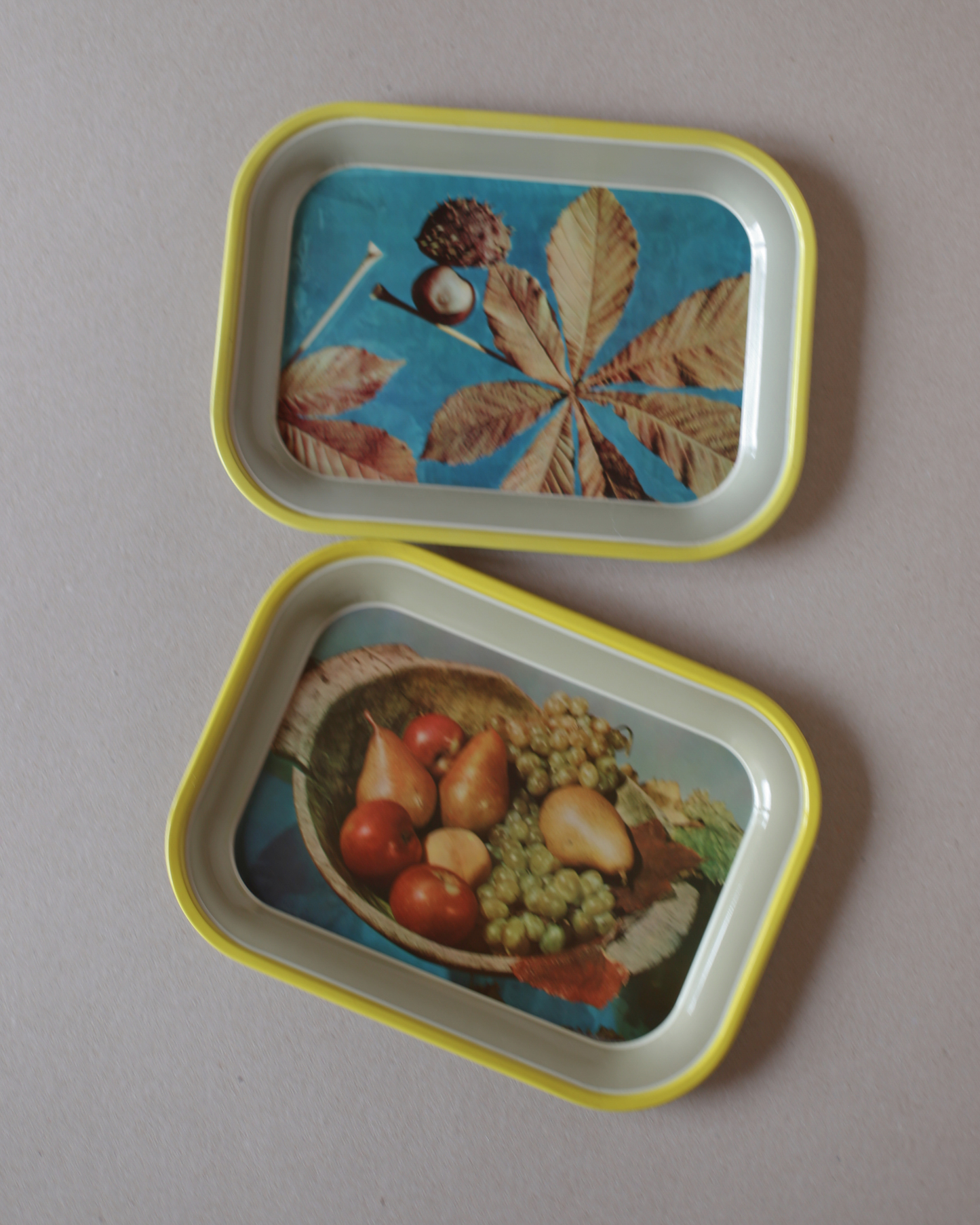 A Set of 2 Vintage Tin Trays by Saturnus