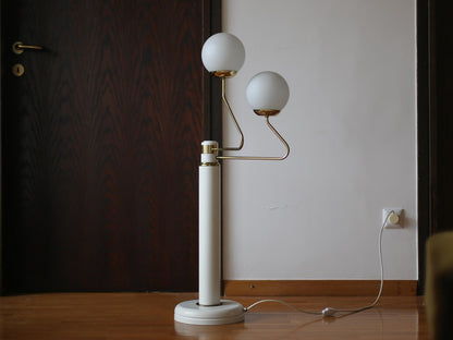 Full view of vintage EMI Poljčane floor lamp with two opaline glass globes
